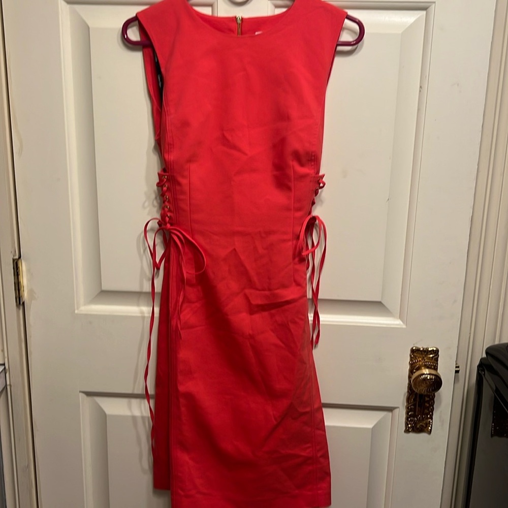 Calvin Klein coral dress with corset ties on each side. Women’s size 8